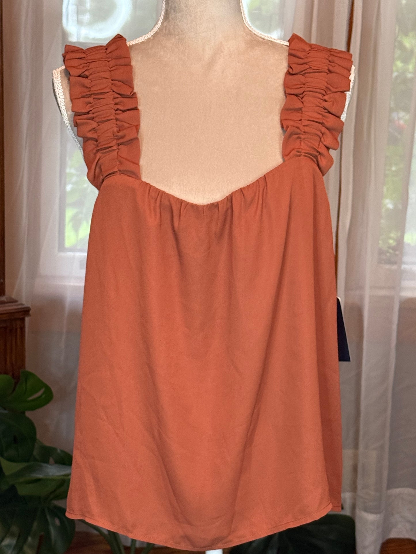 Melrose & Market Rust Tank